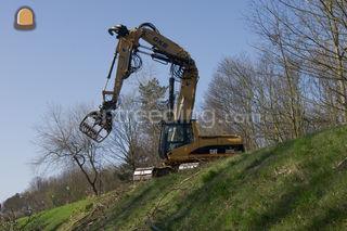 CAT 325 met bomengrijper Omgeving De IJsselsteden