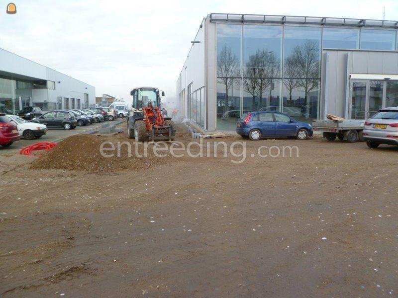 Klaarleggen legbed met lasergestuurde wiellader