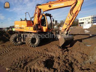 Doosan DX140W Omgeving Roosendaal