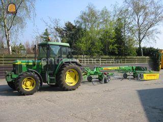 John Deere   6110 met rug... Omgeving Breda