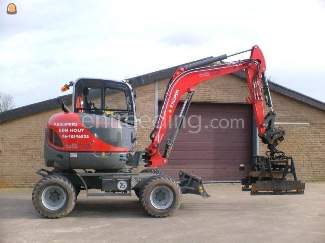 Neuson 6503 WD 6 ton met hydraulische Beco stenenklem halfpakket