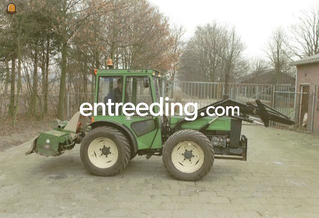 Holder kniktractor met grondfrees